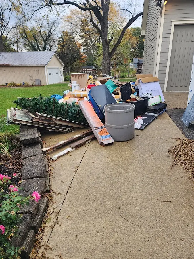 Dumpster being loaded with debris for Commercial Dumpster Rental in Barnhart